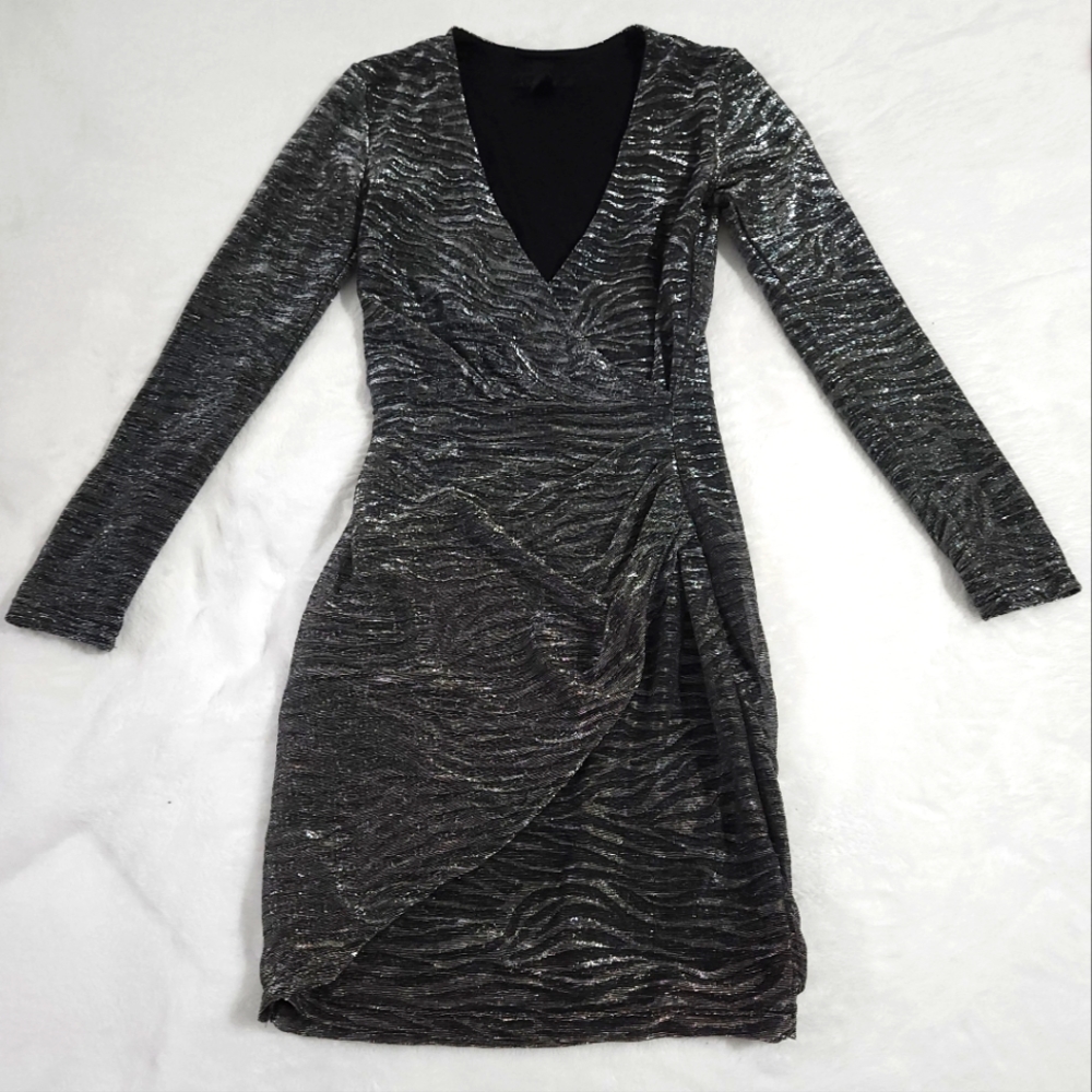 Only worn once! Form fitting dress with plunge neckline for a hot date.